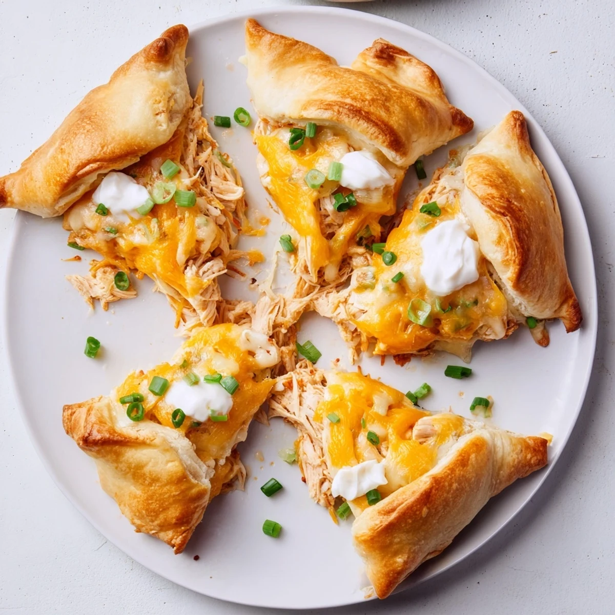 Golden brown cheesy chicken crescent bake with bubbling cheese filling and flaky pastry crust