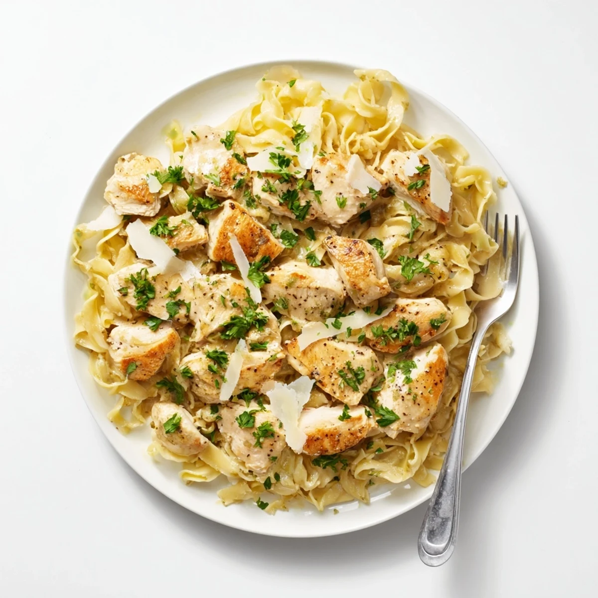 Tender seasoned chicken served over silky one pan buttered noodles in a single skillet for easy cleanup