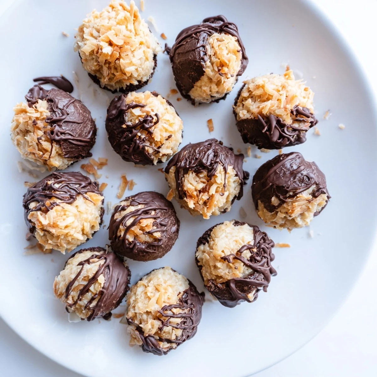 Homemade no bake Samoa bites featuring chocolate dipped bottoms with coconut caramel topping