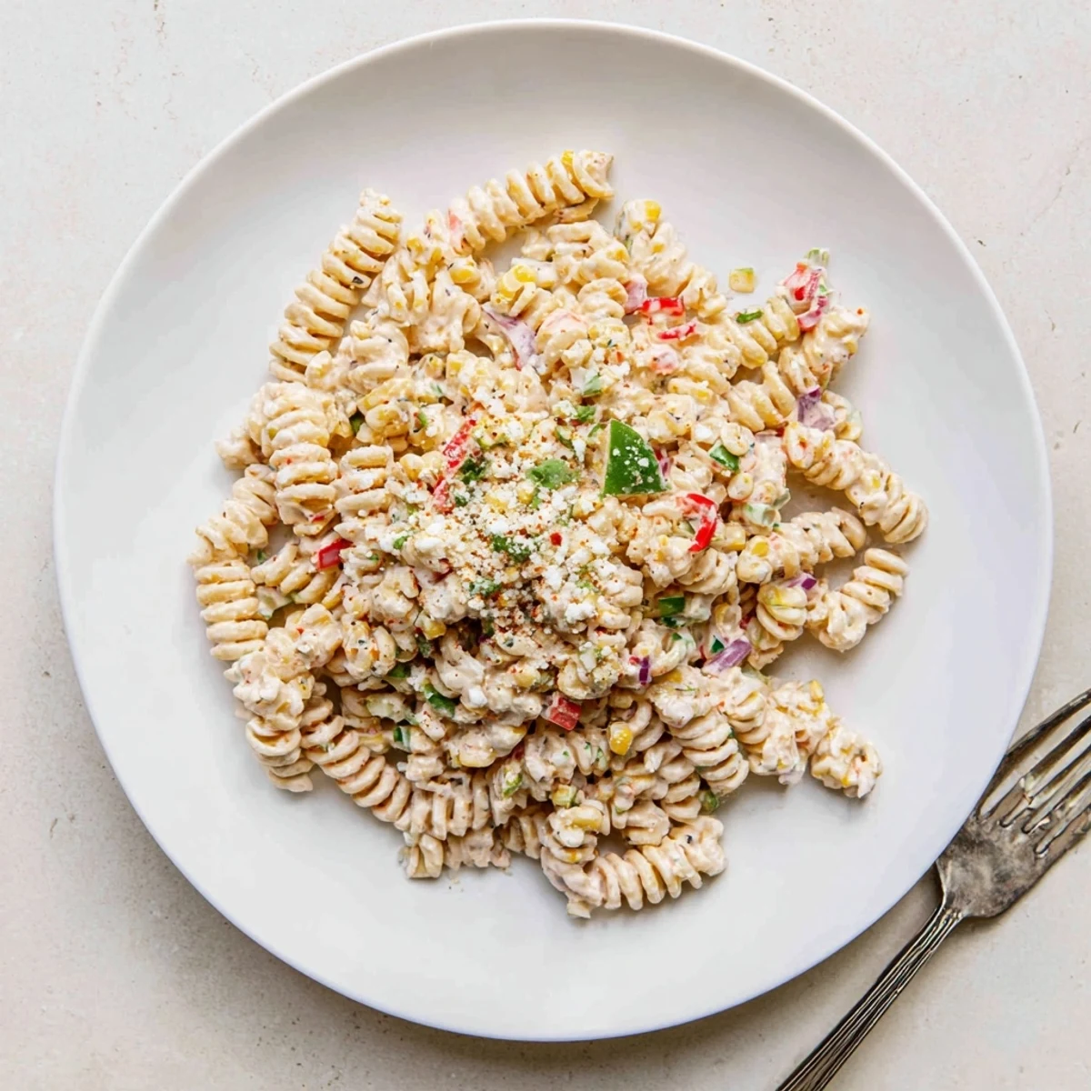 Creamy Street Corn Pasta Salad tossed with smoky grilled corn and tangy lime
