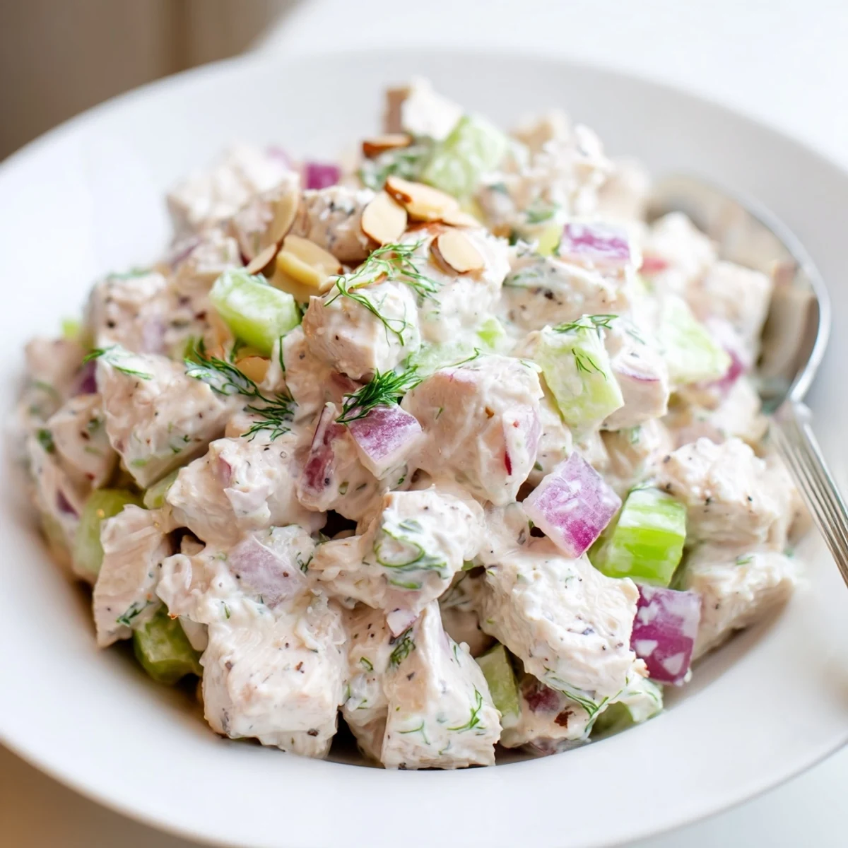 A light Healthy Greek Yogurt Chicken Salad Recipe, chilled and served over greens