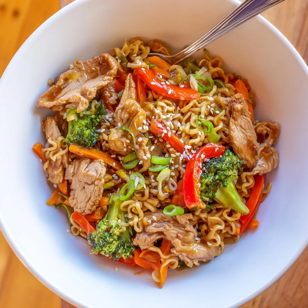 Pan-seared Chicken Ramen Stir Fry with bouncy noodles, broccoli, and sesame seeds