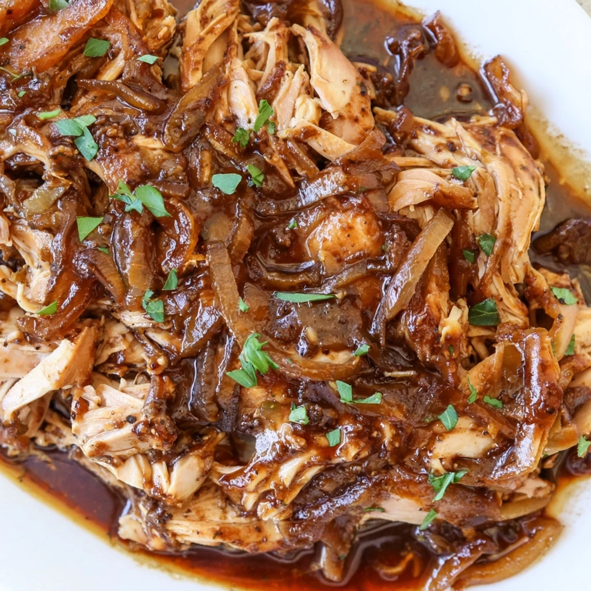 Juicy slow cooker balsamic chicken drizzled with a glossy, sweet-and-savory reduction