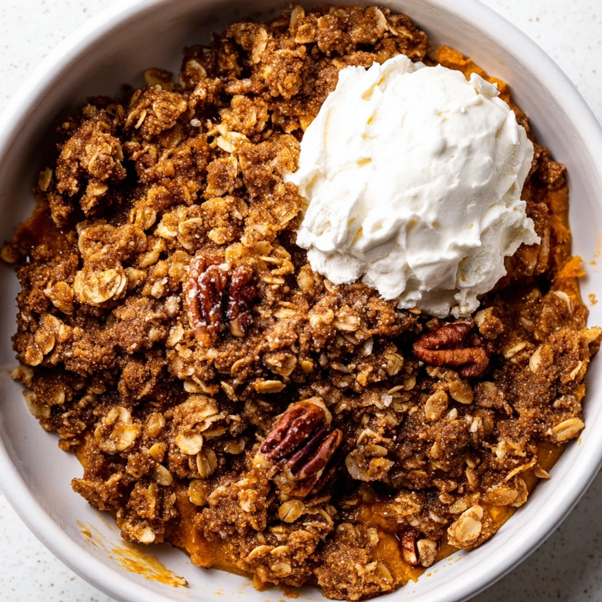 Spiced pumpkin pie crisp bubbling under a buttery brown sugar oat crust