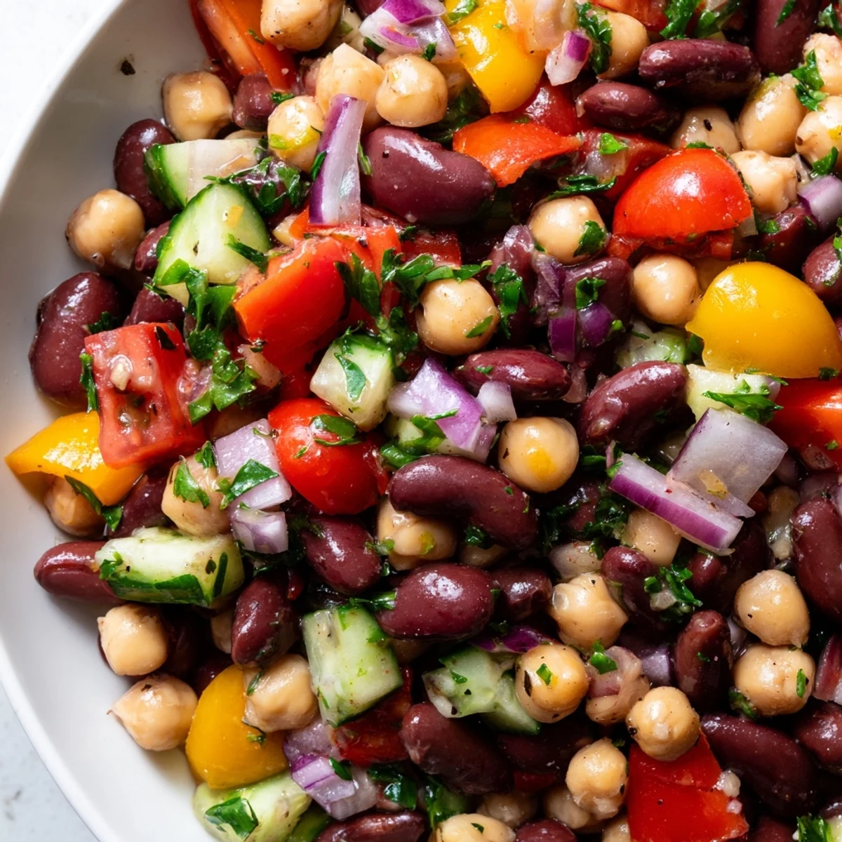 Italian bean salad featuring tender cannellini and chickpeas coated in a zesty herb dressing.