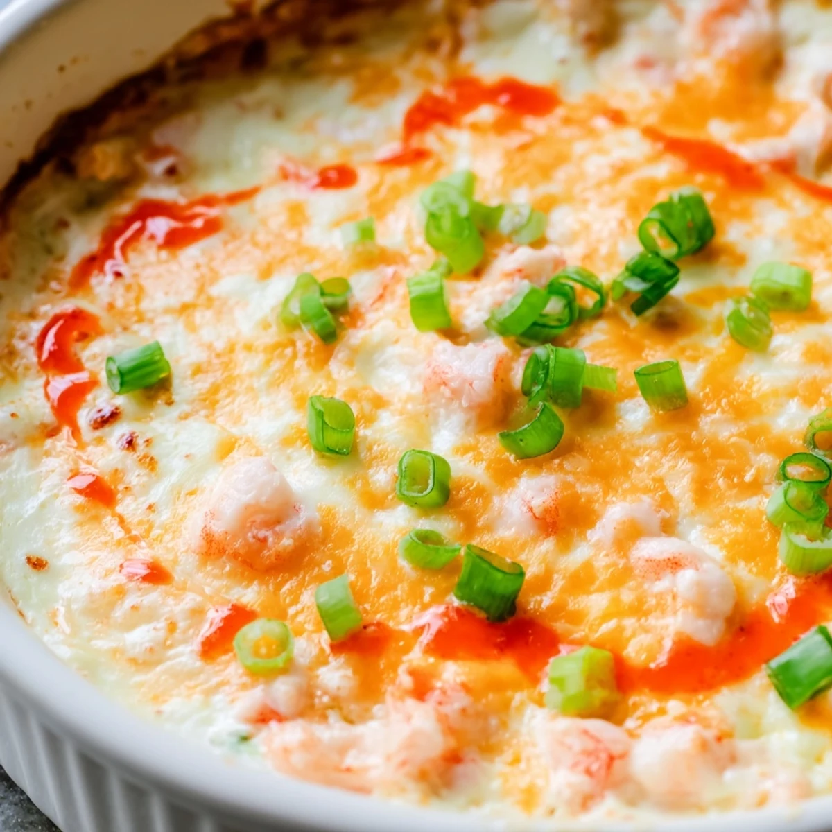 Spicy extra cheesy bang bang shrimp dip served warm with crispy tortilla chips for dipping