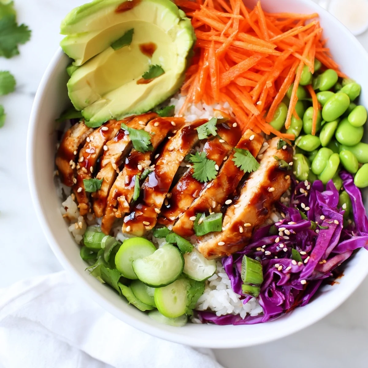 Tangy sesame-ginger dressing drizzled over a vibrant Asian Inspired Chicken Power Bowl