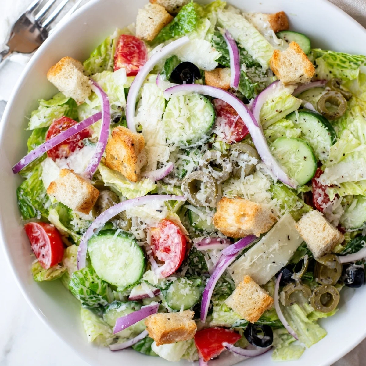Crisp Olive Garden Salad topped with croutons, Parmesan, and tangy Italian dressing.