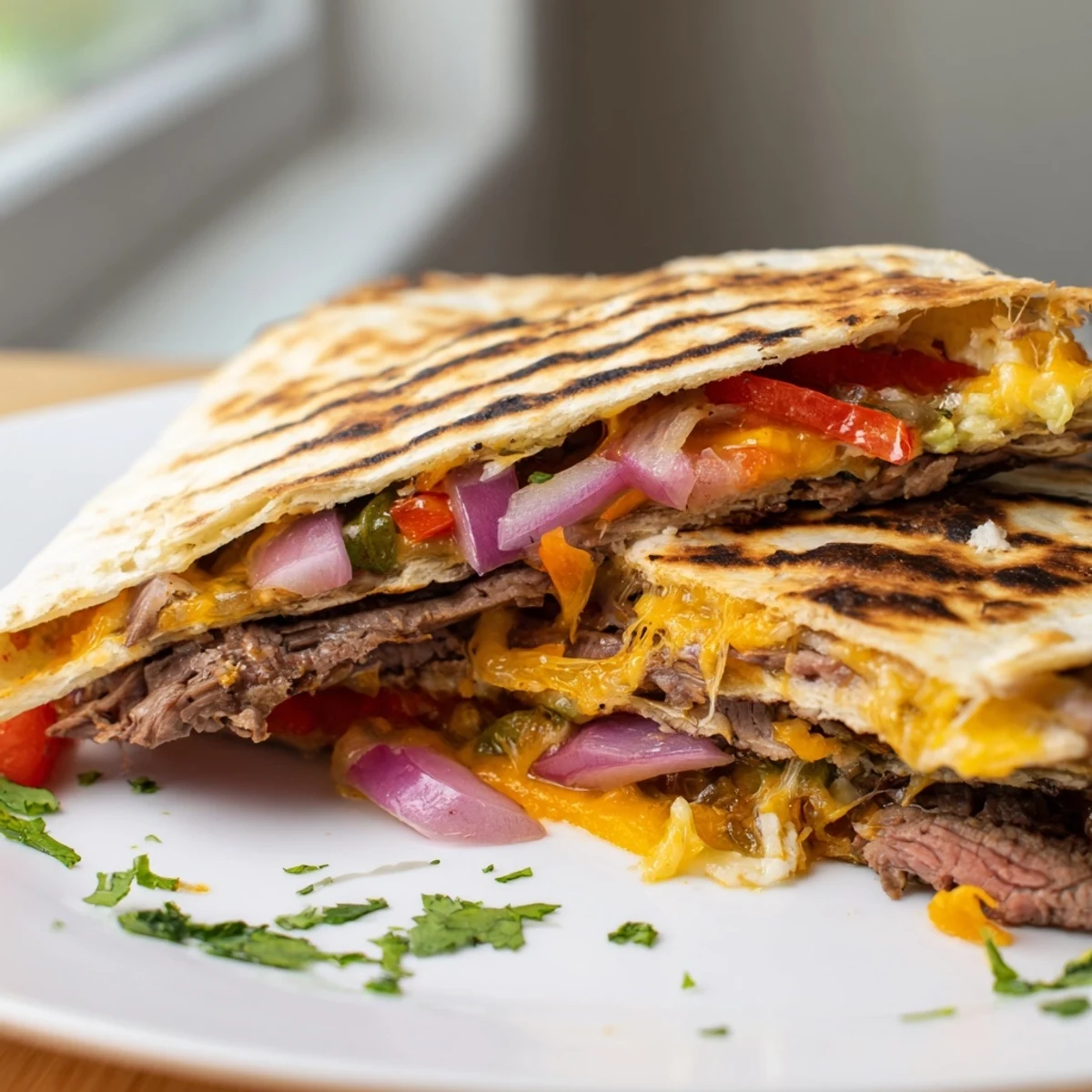 Crispy steak quesadillas oozing with cheese, served with salsa and guacamole