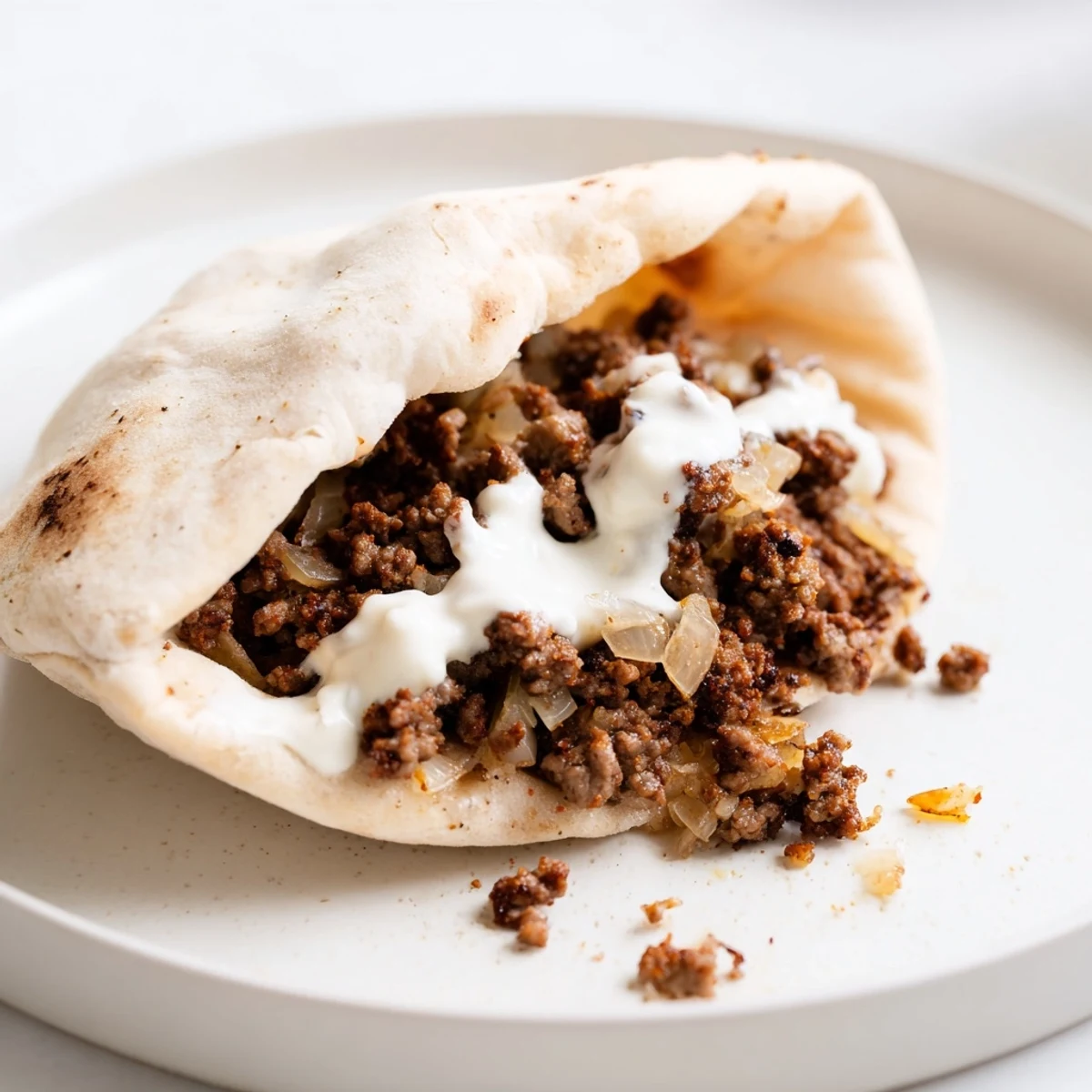 Warm pita filled with spiced Mediterranean ground beef pita pockets and fresh veggies.  